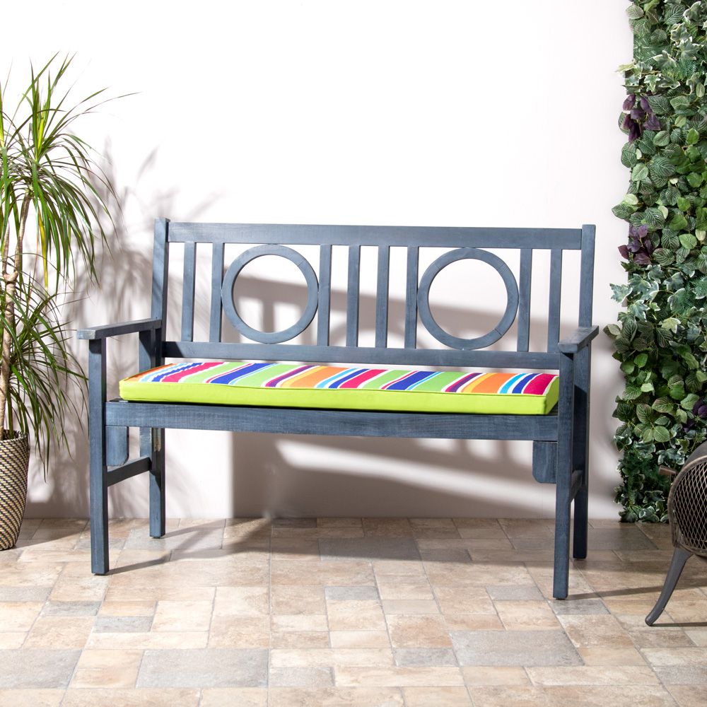 Technicolour stripe bench pad on bench in yard