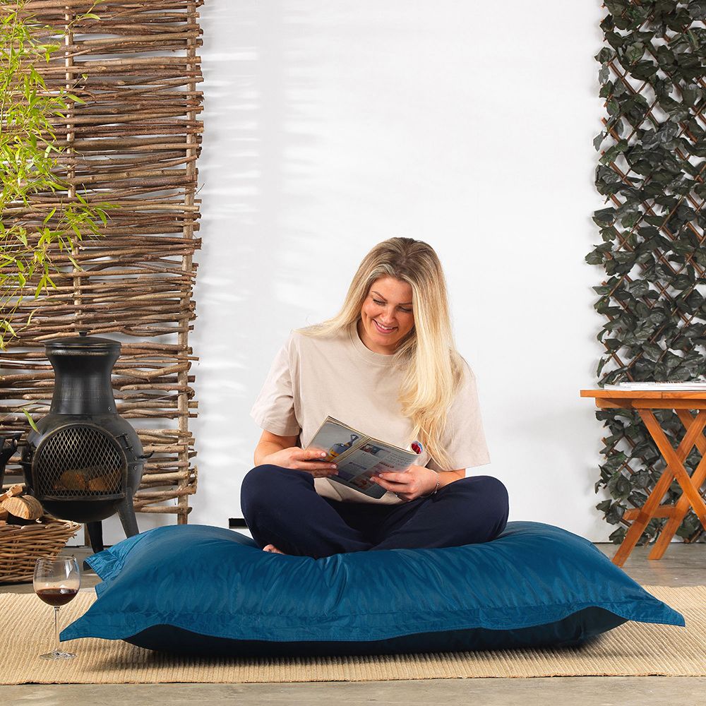 Medium Bazaar Bag® Floor Cushion Bean Bag by Veeva® in teal with model