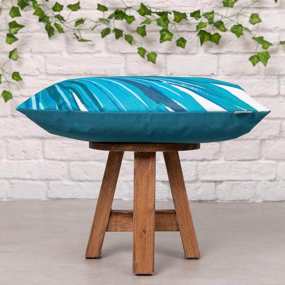 teal palm print outdoor cushion side view