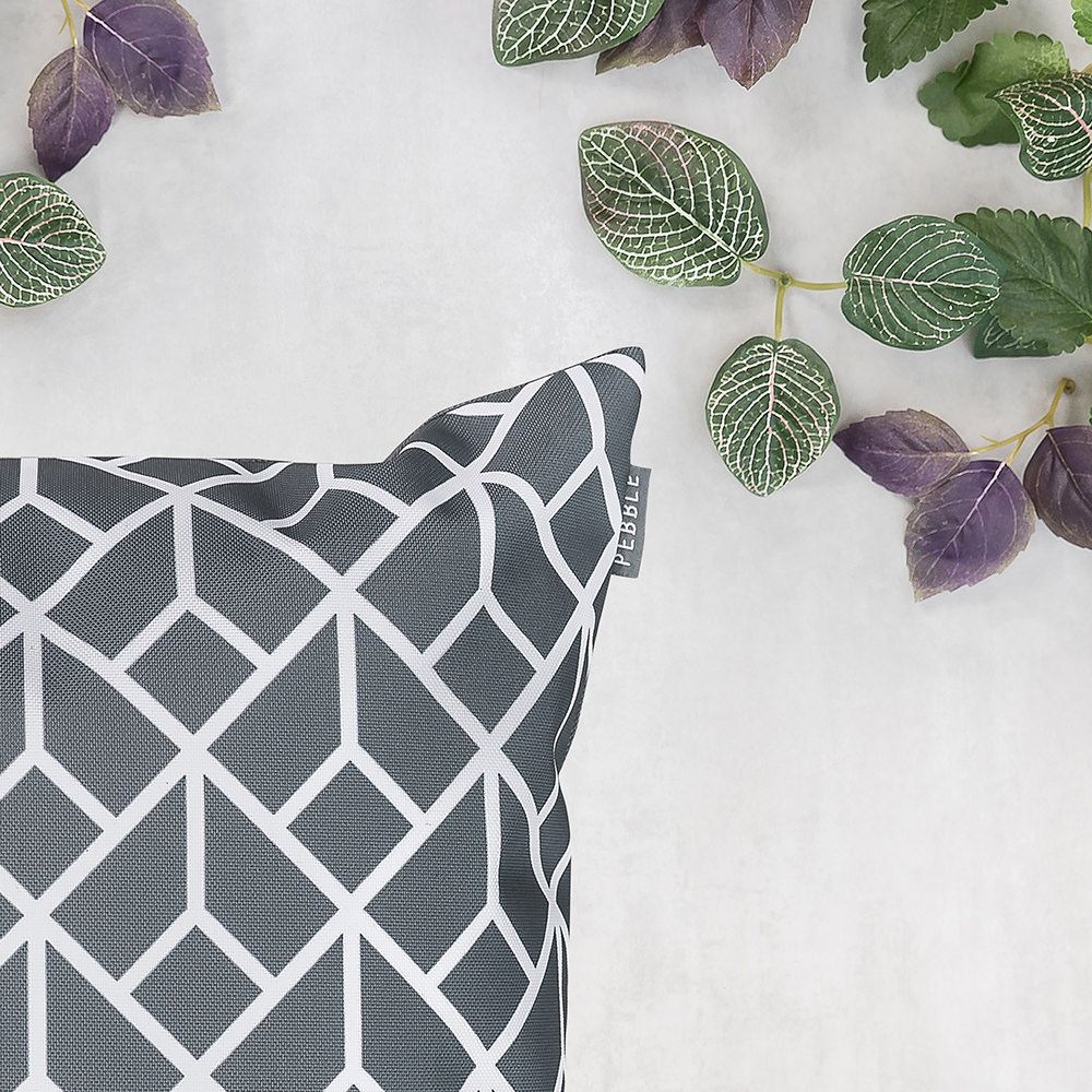Charcoal grey geometric outdoor cushion close up