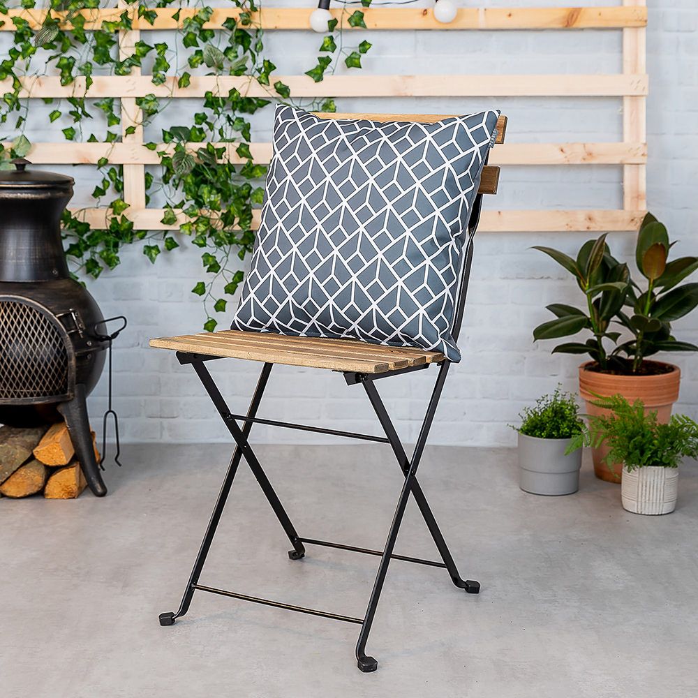 Charcoal grey geometric outdoor cushion lifestyle