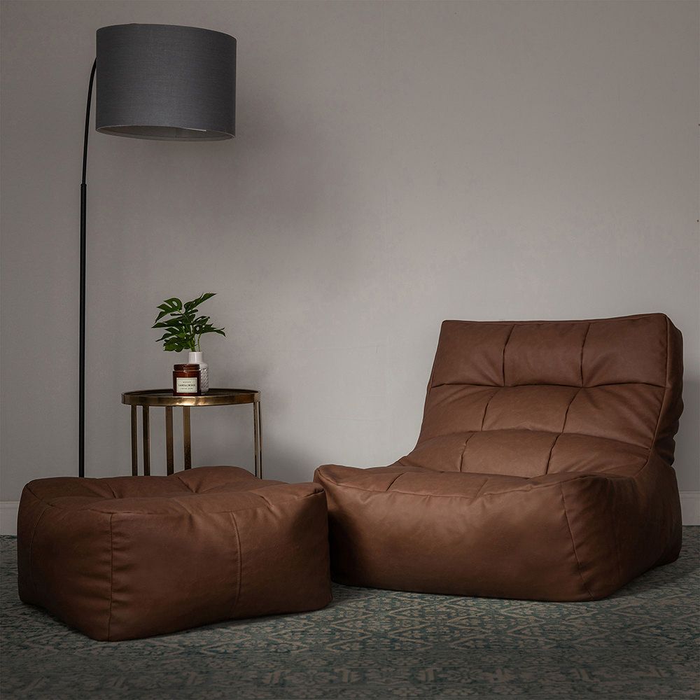 icon® Lucia Faux Leather Footstool in brown with footstool lifestyle