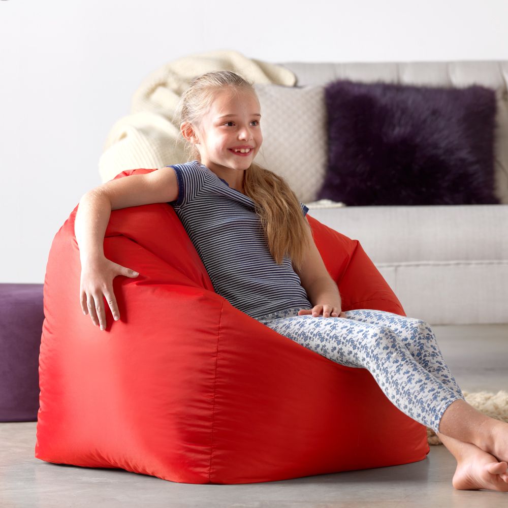 girl sitting in red teen bean bag