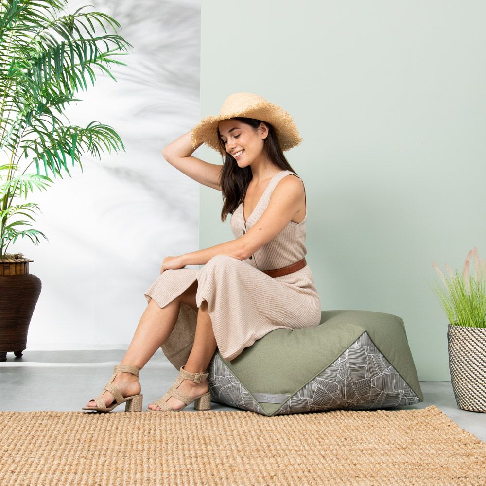 Lady sitting on palm print diamond bean bag pouffe sage green 