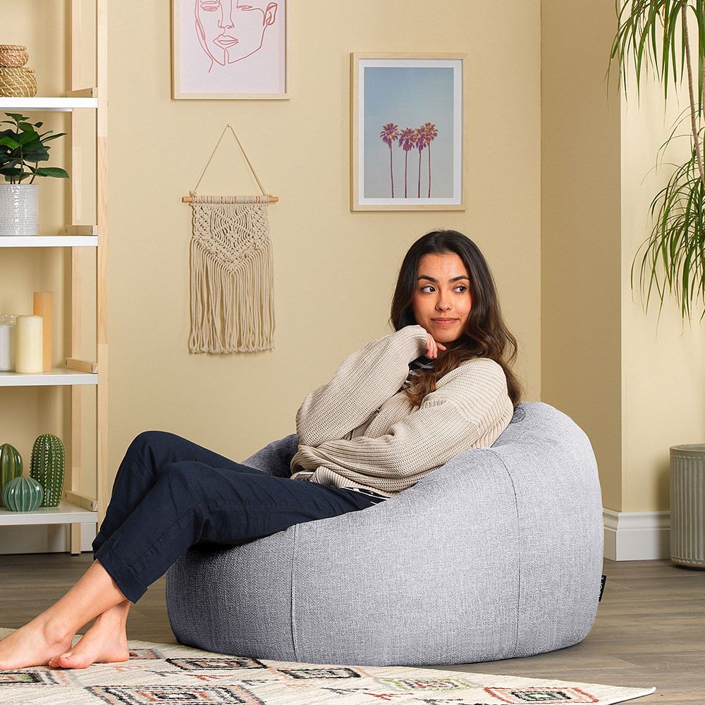 icon® Lina Classic Bean Bag in grey with model in living room