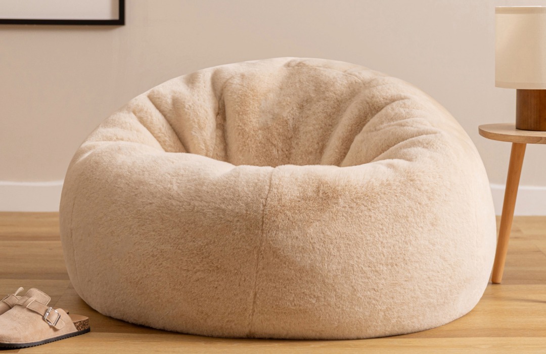 Fluffy Beige coloured bean bag in a scandi-inspired living room set up. The faux fur is super fluffy.